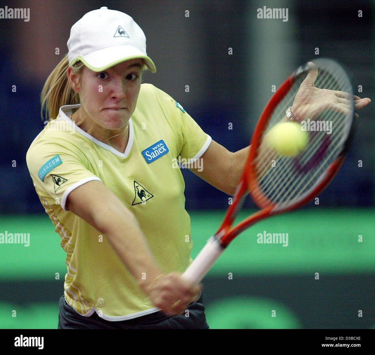 (dpa) - Belgium's Justine Henin plays a backhand during the eighth final match of the 13th International Sparkassen Cup WTA Tournament in Leipzig, Germany, 25 September 2002. Stock Photo