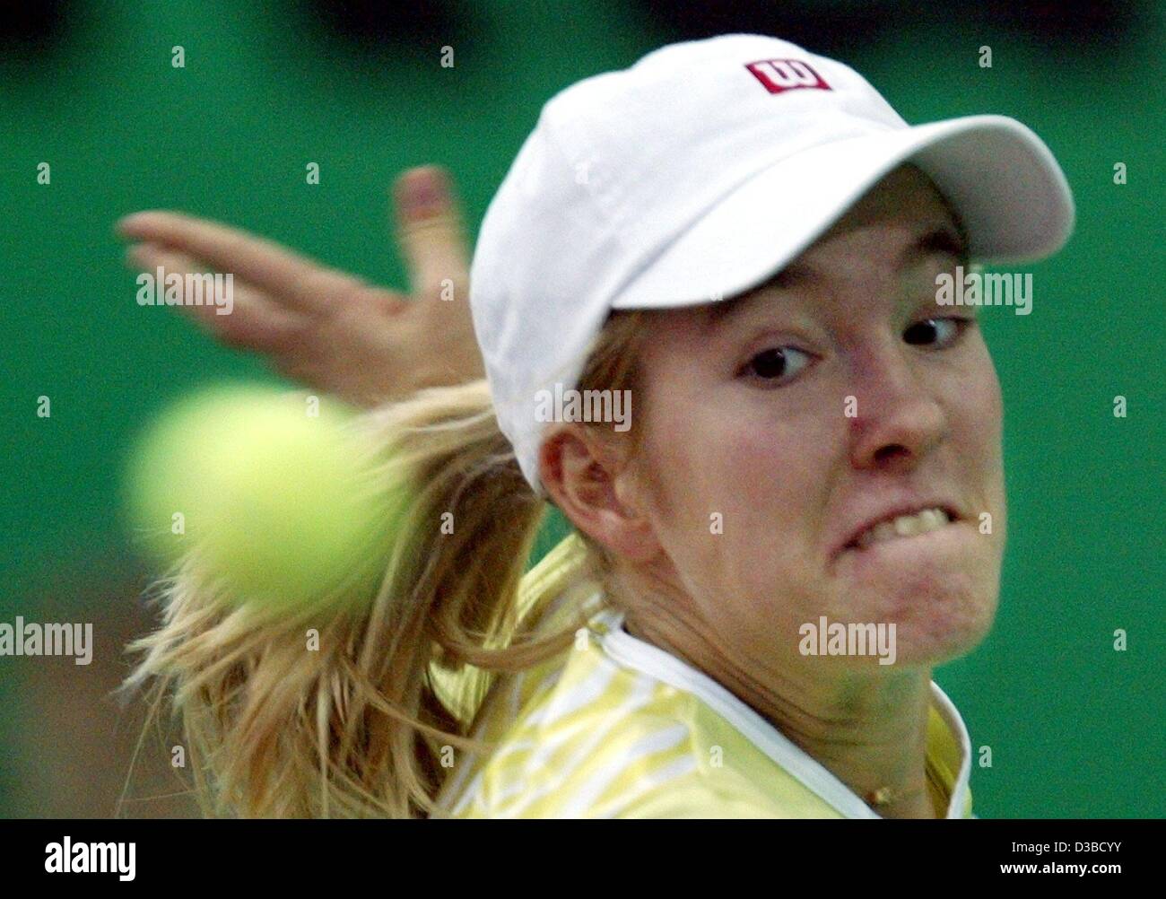 (dpa) - Belgium's Justine Henin returns a ball during the quarter final match of the 13th International Sparkassen Cup WTA Tournament in Leipzig, Germany, 27 September 2002. She defeats Slovakia's Daniela Hantuchova 6:4 and 7:5. Stock Photo