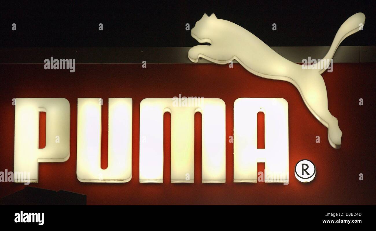(dpa) - The logo of the sports equipment producer Puma is illuminated in a Puma shop in Herzogenaurach, Germany, 30 January 2003. The sports equipment producer more than doubled its earnings last year. In an already successful year, fourth-quarter earnings have also been much higher than expected. Stock Photo