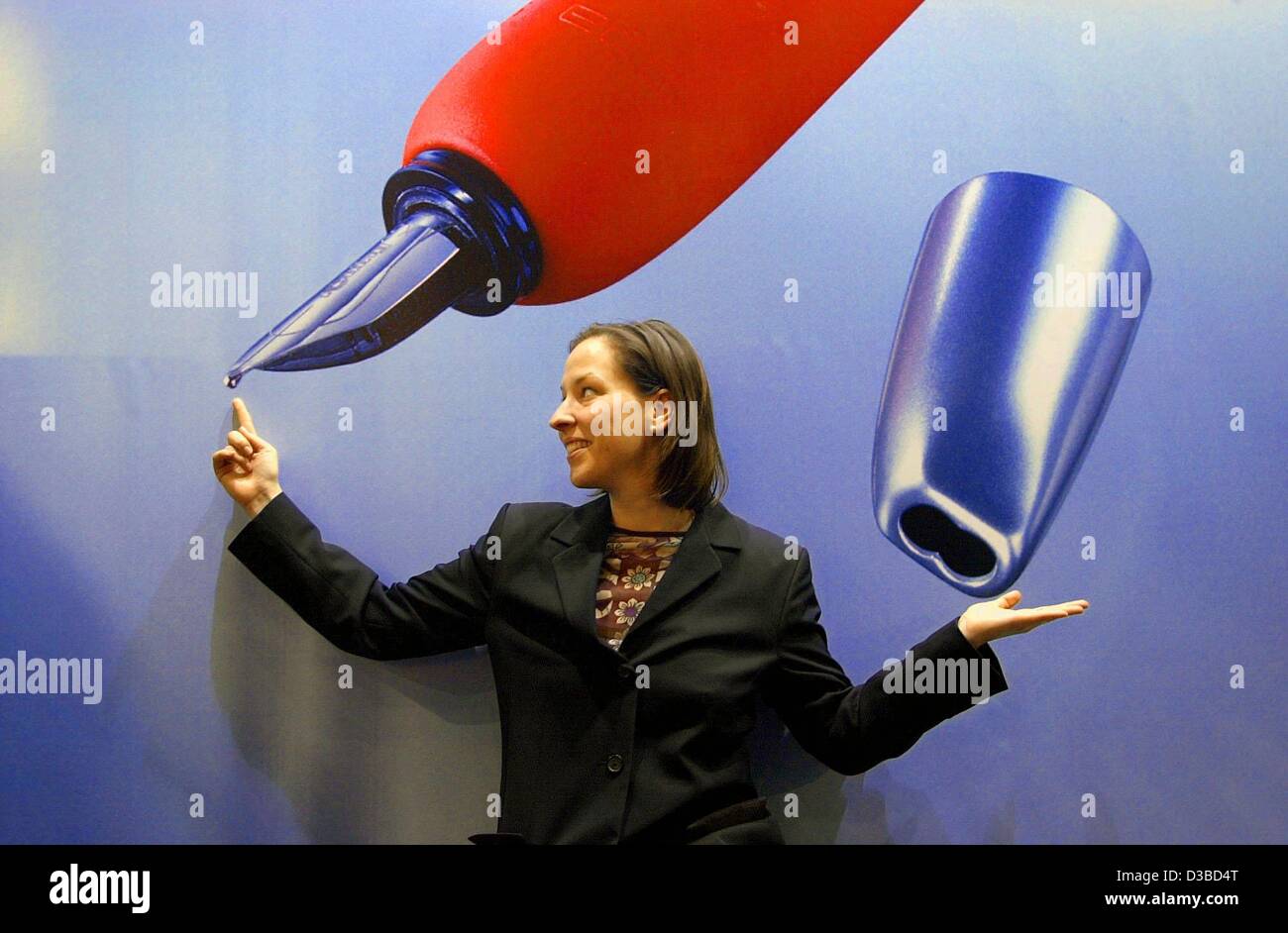 (dpa) An employee from the Rotring company poses in front of a