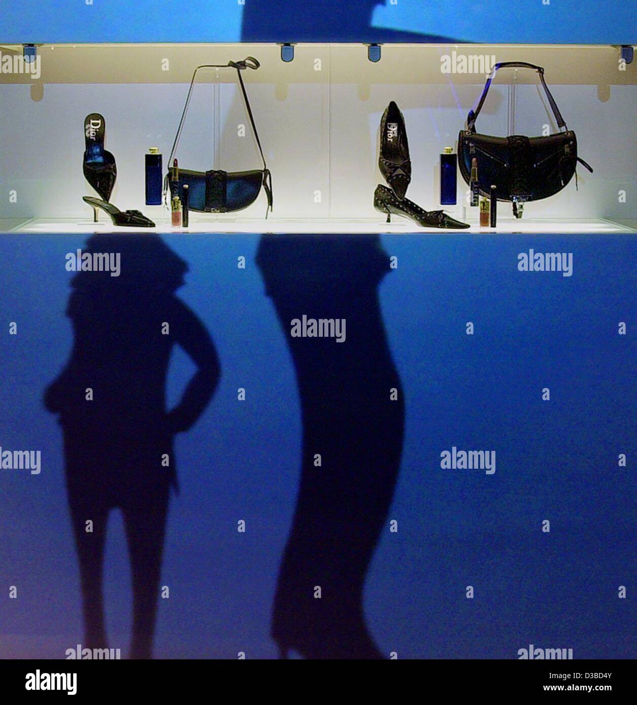(dpa) - Human silhouettes enhance the display of ladies' accessories at Dior's booth at the beauty trade fair ('BeautyWorld 2003') in Frankfurt, Germany, 27 January 2003.  The accessories include cosmetics as well as evening shoes and handbags.  According to the fair's organizers, BeautyWorld is the Stock Photo
