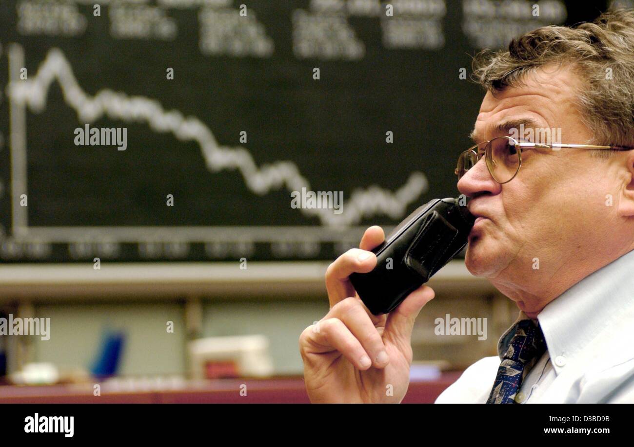 (dpa) - A broker worries about the market trend at the Frankfurt stock exchange, 22 January 2003. After a short rise, the Dax faced a decline and shortly hit a new low with 2766 points, equalling the status of October 2002. An upward trend is slowed down by the discussion on the war in Iraq, the str Stock Photo