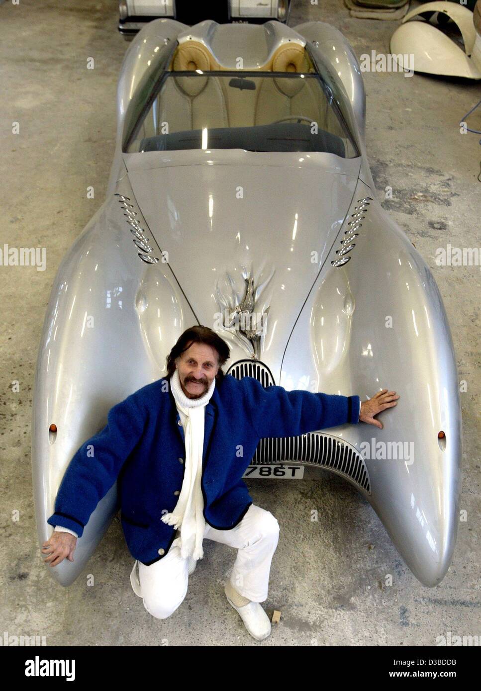 (dpa) - Industrial designer Luigi Colani is proudly posing with a Horch Colani C1 car (500 hp, V8) in his workshop in Karlsruhe, Germany, 13 January 2003. The Berlin born has been fighting against straight and angular forms for decades and all over the world. 'Where I am is the centre of design', Co Stock Photo