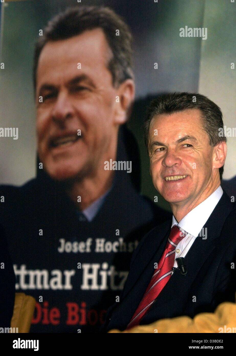 (dpa) - Ottmar Hitzfeld, coach of Germany's successful football club FC Bayern Muenchen, presents his biography in Munich, 27 January 2003. The book was written by the priest Josef Hochstrasser, a friend of Hitzfeld. The reader gets surprisingly deep insight into the feelings of Hitzfeld, who has be Stock Photo