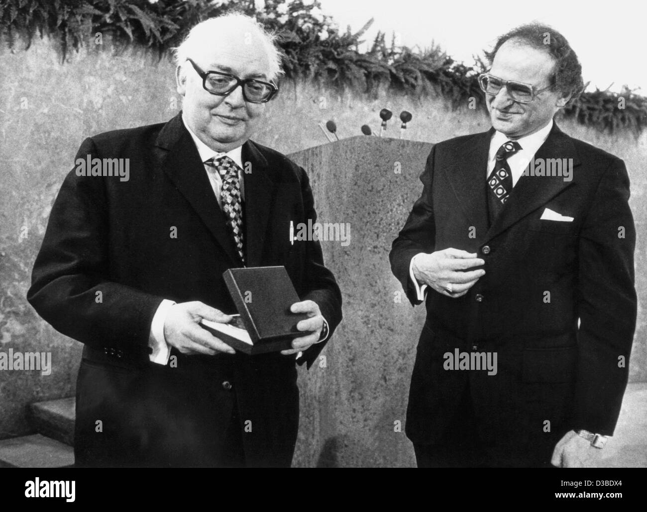 (dpa files) - The Swiss author and playwright Friedrich Duerrenmatt (L) is awarded the Buber-Rosenzweig-Medaille (Buber Rosenzweig Medal) by the Rabbi Nathan Peter Levinson, Frankfurt, 6 March 1977. The medal is awarded to honour his solidarity with Jews and his commitment to the state of Israel. Du Stock Photo
