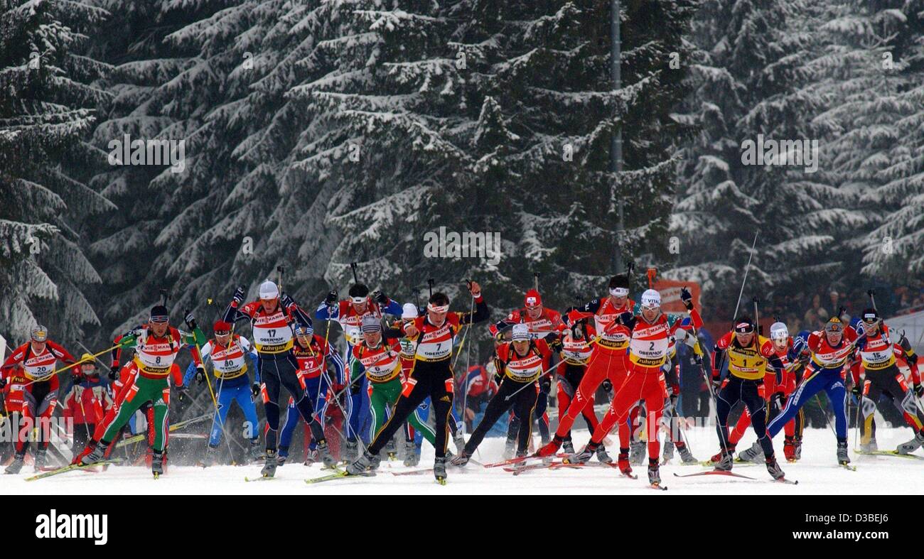 (dpa) - The racers are on their way during the men's 15 km race at the Biathlon World Cup in Oberhof, eastern Germany, 12 January 2003. In the end the Norwegian Ole Einar Bjoerndalen (No. 2) wins before Bulgarian Vladimir Dratschev (No. 8) and French Raphael Poiree (No. 1). Stock Photo