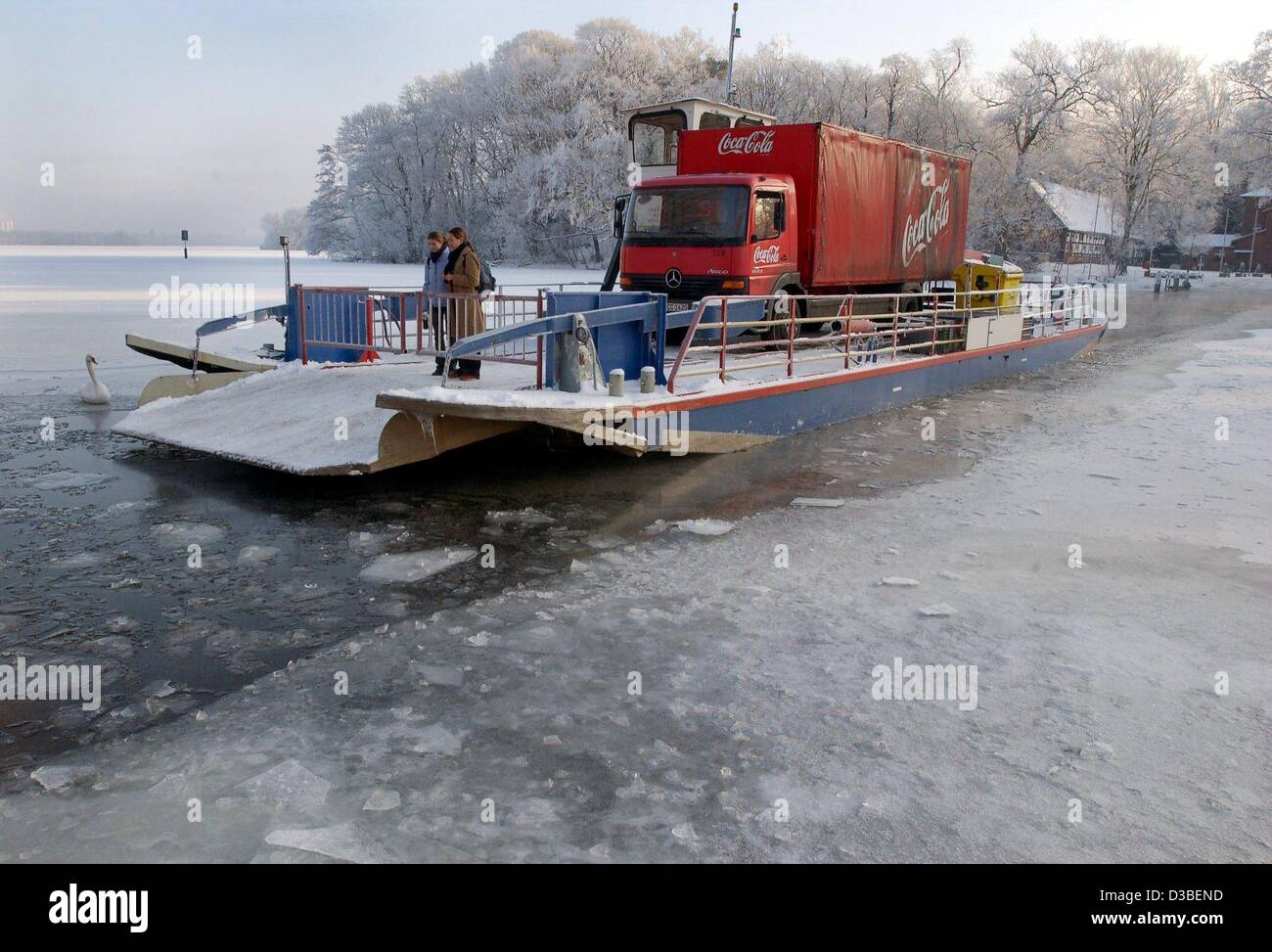 (dpa) - A car ferry makes its way through the frozen river Havel in Berlin, 8 January 2003. Stock Photo