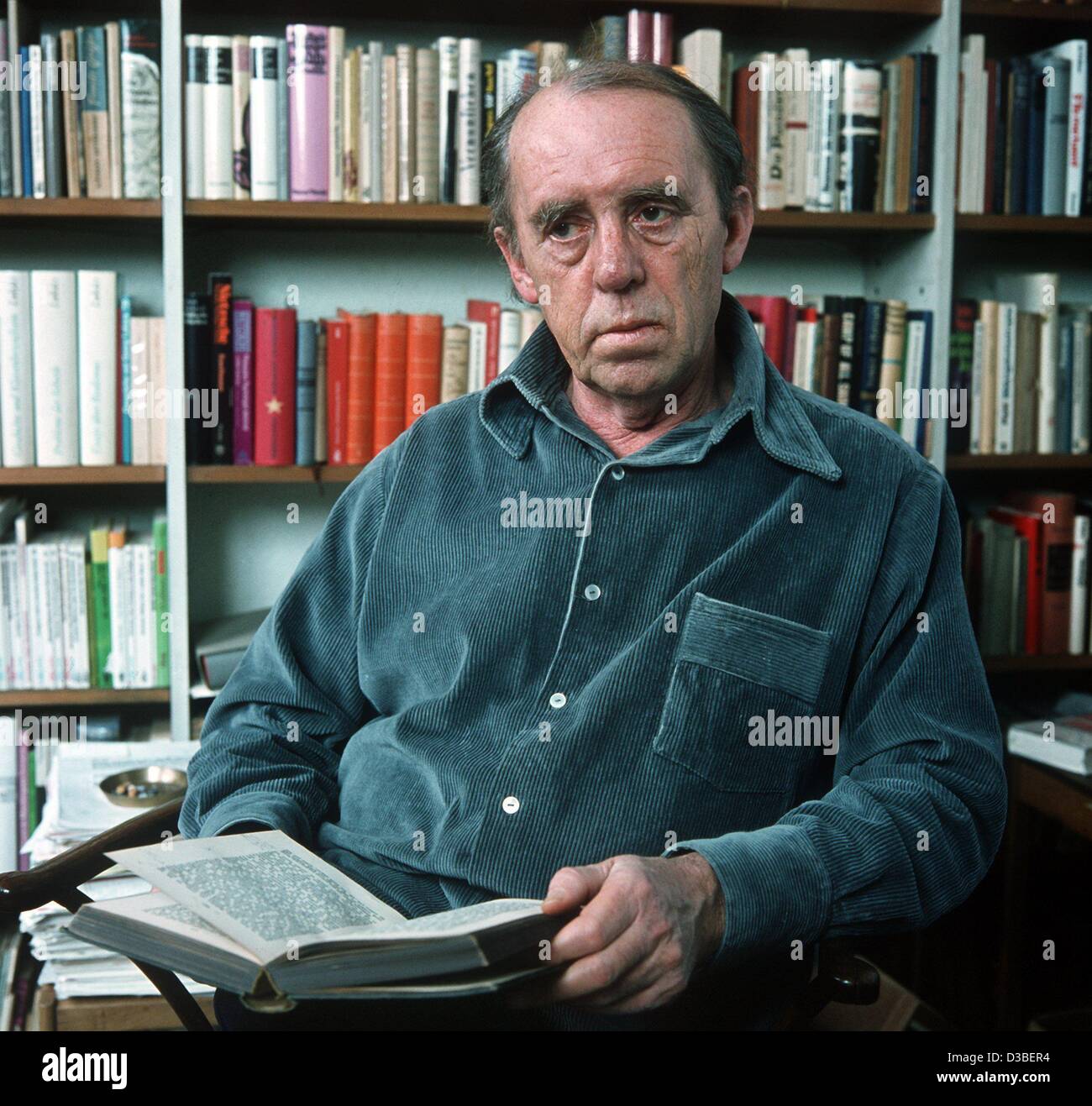 (dpa files) - German author Heinrich Boell in his apartment in Cologne, West Germany, December 1977. Boell was born 21 December 1917 in Cologne and died in Kreuzau, West Germany, 16 July 1985. In 1962 he received the Buechner Award and in 1972 the Noble Prize for Literature. Some of his famous works Stock Photo