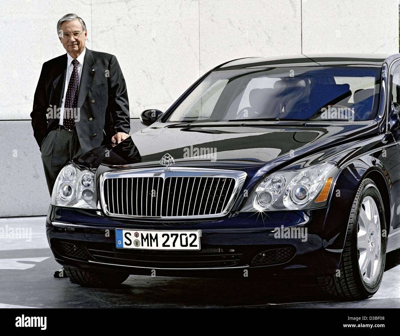 (dpa) - An undated handout shows Hermann Gaus, longtime director of the car development branch of the Daimler-Benz corporation and since 2001 project manager of the Maybach, posing next to a Maybach limousine. The 67-year-old 'Mr Maybach' will retire on March 2003. Stock Photo