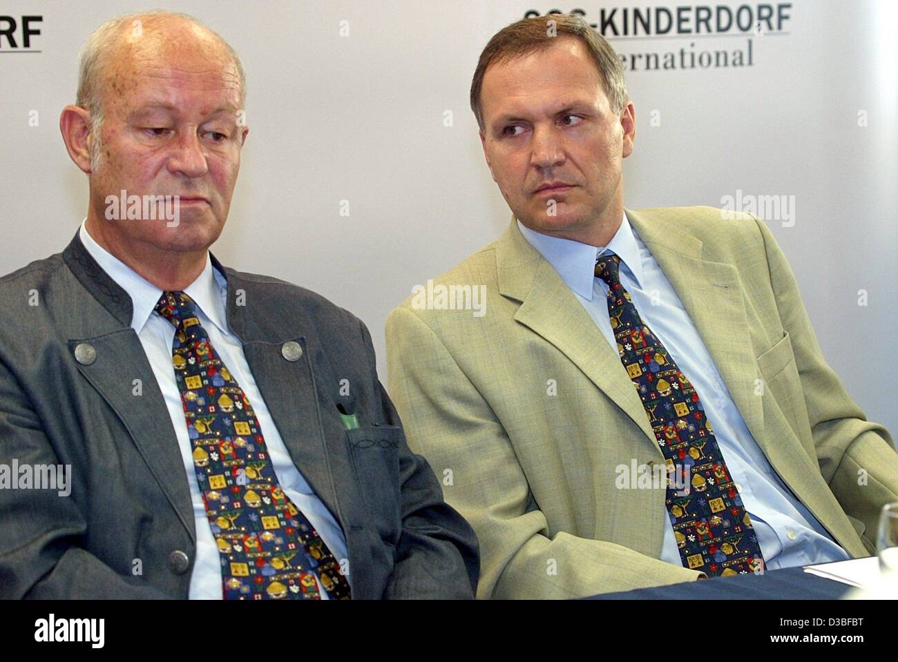 (dpa) - Helmut Kutin (L), President of SOS Children's Village International, and Richard Pichler, General Secretary of the organisation, pictured during a press conference in the scope of the 17th general meeeting in Innsbruck, Austria, 26 June 2003. Kutin was reelected to serve a further five-year  Stock Photo