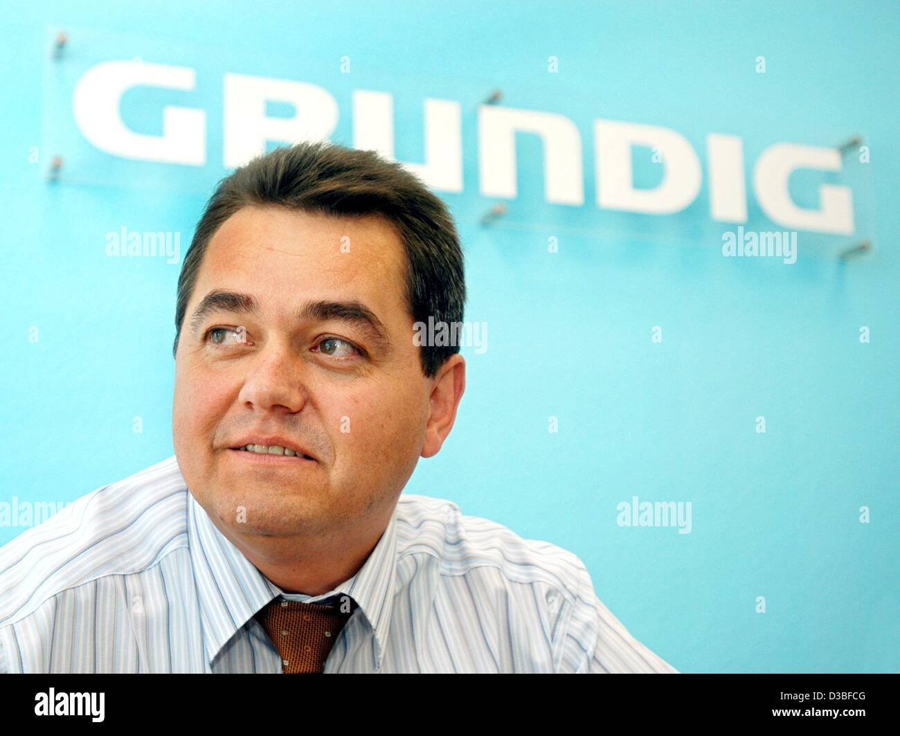 (dpa) - Werner Saalfrank, CEO of the electronics company Grundig, pictured during a press conference in Nuremberg, Germany, 25 June 2003. Grundig announced that it will continue its business operations despite the company's filing for insolvency. Grundig, a company that was once a byword for the Ger Stock Photo