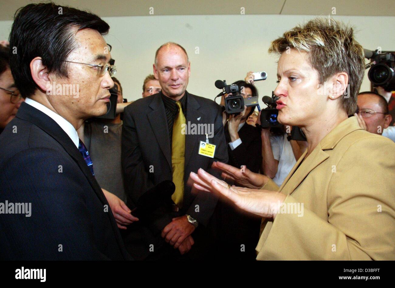 (dpa) - Renate Kuenast (Green Party), German Minister for Consumer Protection, Food and Agriculture, talks to Shiro Asamo, the prefect of the whaling region Miyagi,in Japan, before the start of the 55th International Whaling Commission (IWC) conference in Berlin, 16 June 2003. The conference was ope Stock Photo