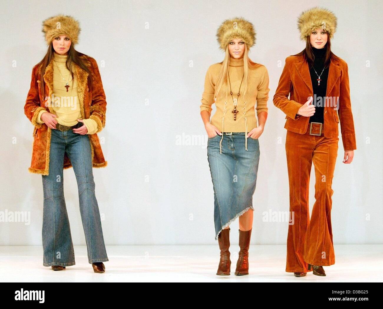 (dpa) - Three models pose on the catwalk and present the fashion collection for the autmn and winter season 2003/2004 during a fashion show at the Intercontinental hotel in Hamburg, Germany, 24 June 2003. Stock Photo