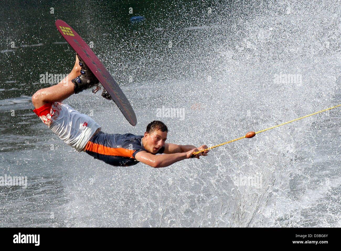 (dpa) - Water skier Christian Wagener flies through the air during his jump on Lake Twistesee near Bad Arolsen, central Germany, 3 June 2003. Stock Photo