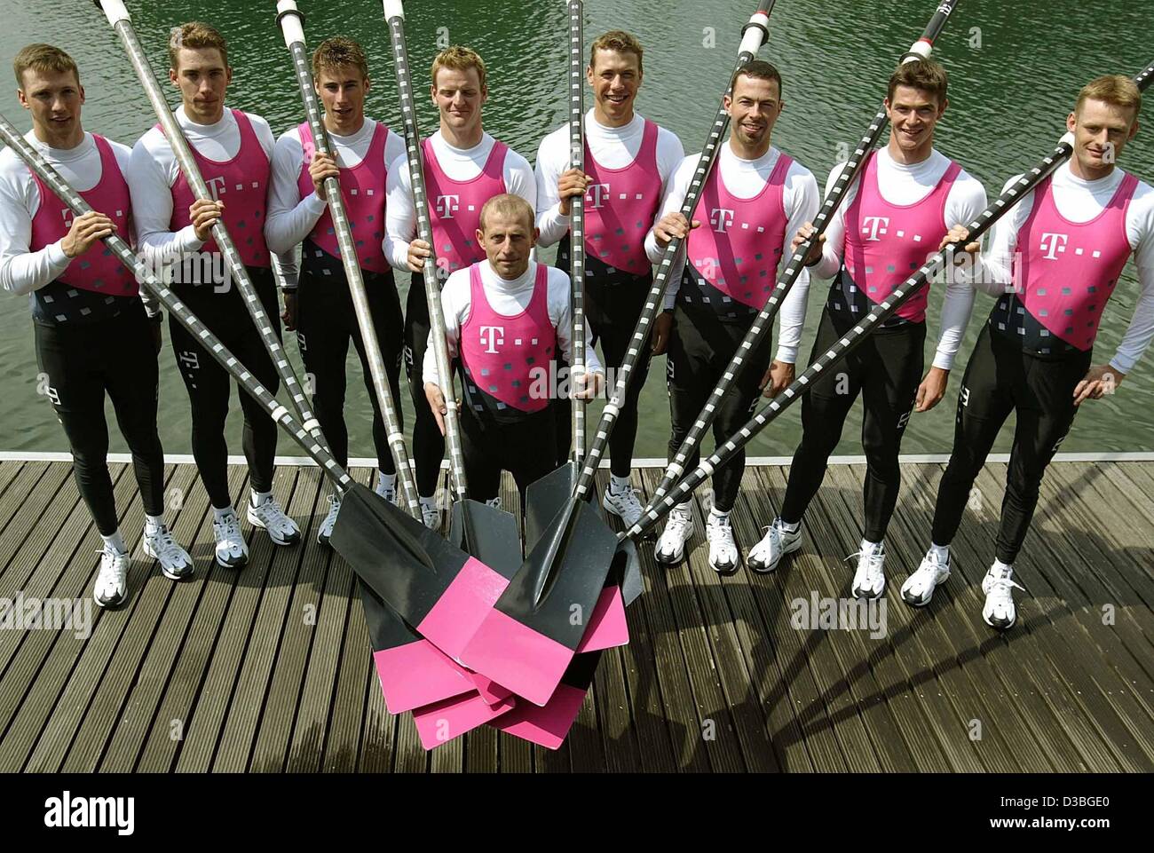 (dpa) - The new men's eight of the German Team Telekom pose with cox Peter Thiede (C), from L: Sebastian Schulte, Thorsten Engelmann, Joerg Diessner, Stefan Koltzk, Johannes Doberschuetz, Enrico Schnabel, Ulf Siemens and Michael Ruhe, in Dortmund, Germany, 15 May 2003. Stock Photo