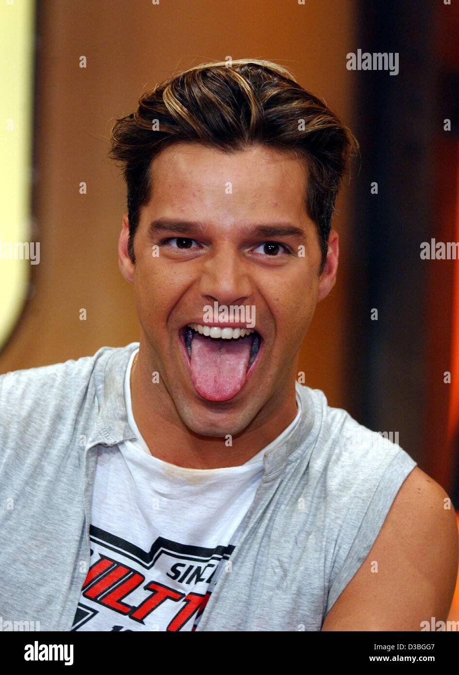 (dpa) - Puertorican pop singer Ricky Martin laughs during the Pro7 German television show 'TV total' in Cologne, Germany, 3 June 2003. Stock Photo