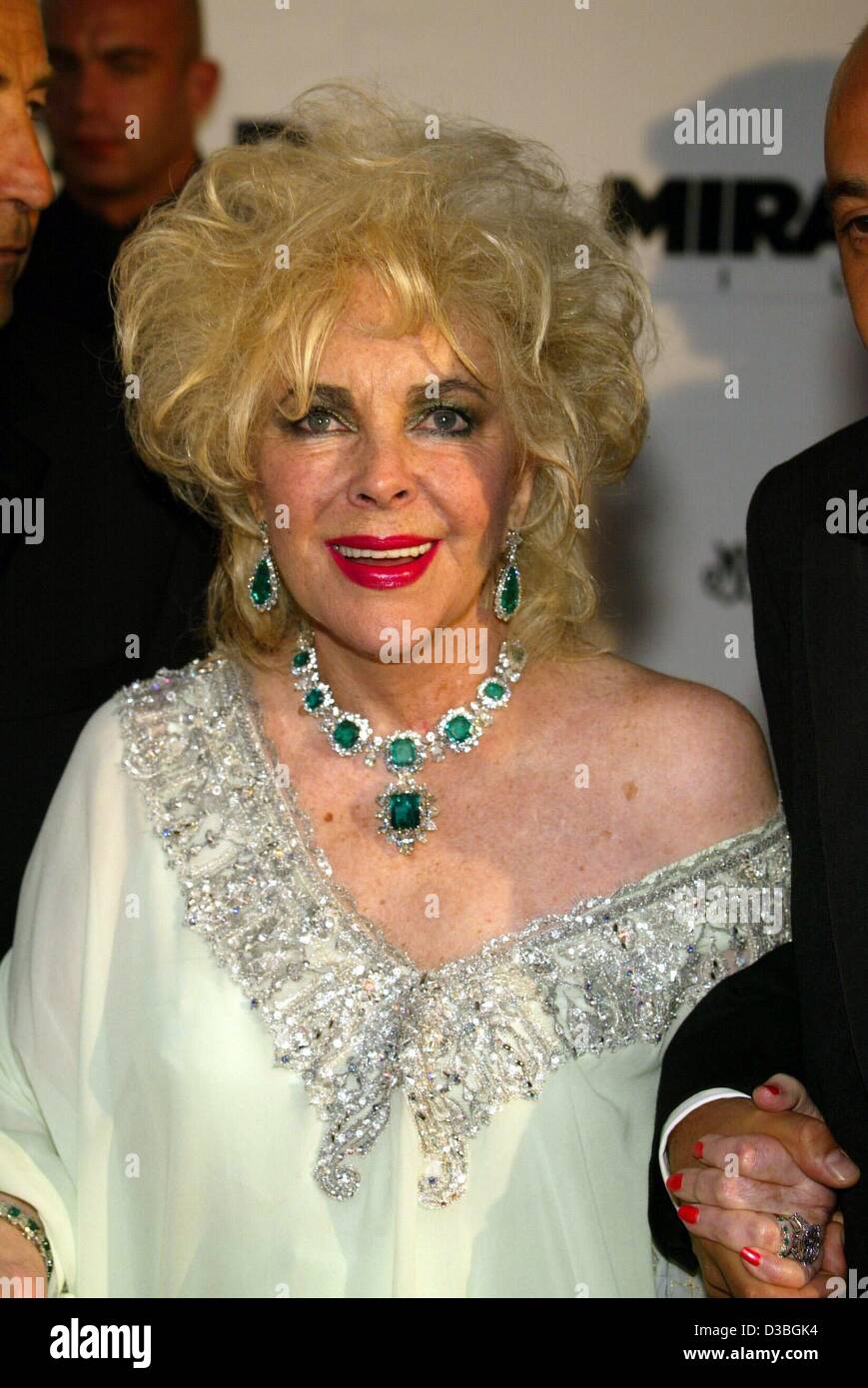 (dpa) - Hollywood diva Elizabeth Taylor smiles as she arrives at the AMFAR (American Foundation for Aids Research) charity gala at the Restaurant Moulin de Mougins near Cannes, France, 22 May 2003. The 71-year-old actress hosted the event which took in 1.3 million dollars in donations. Stock Photo