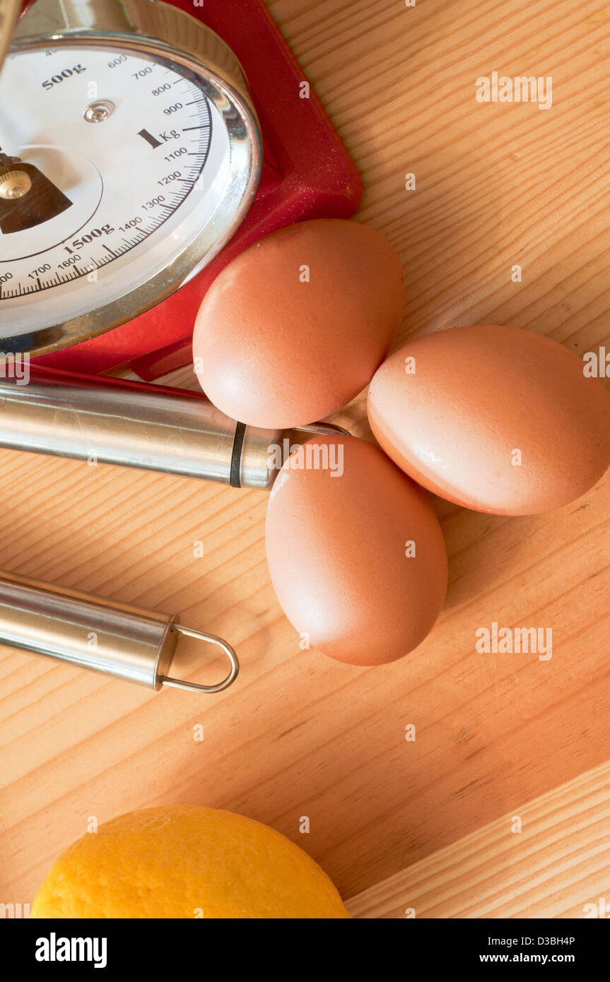 Eggs in the kitchen with kitchen scales Stock Photo