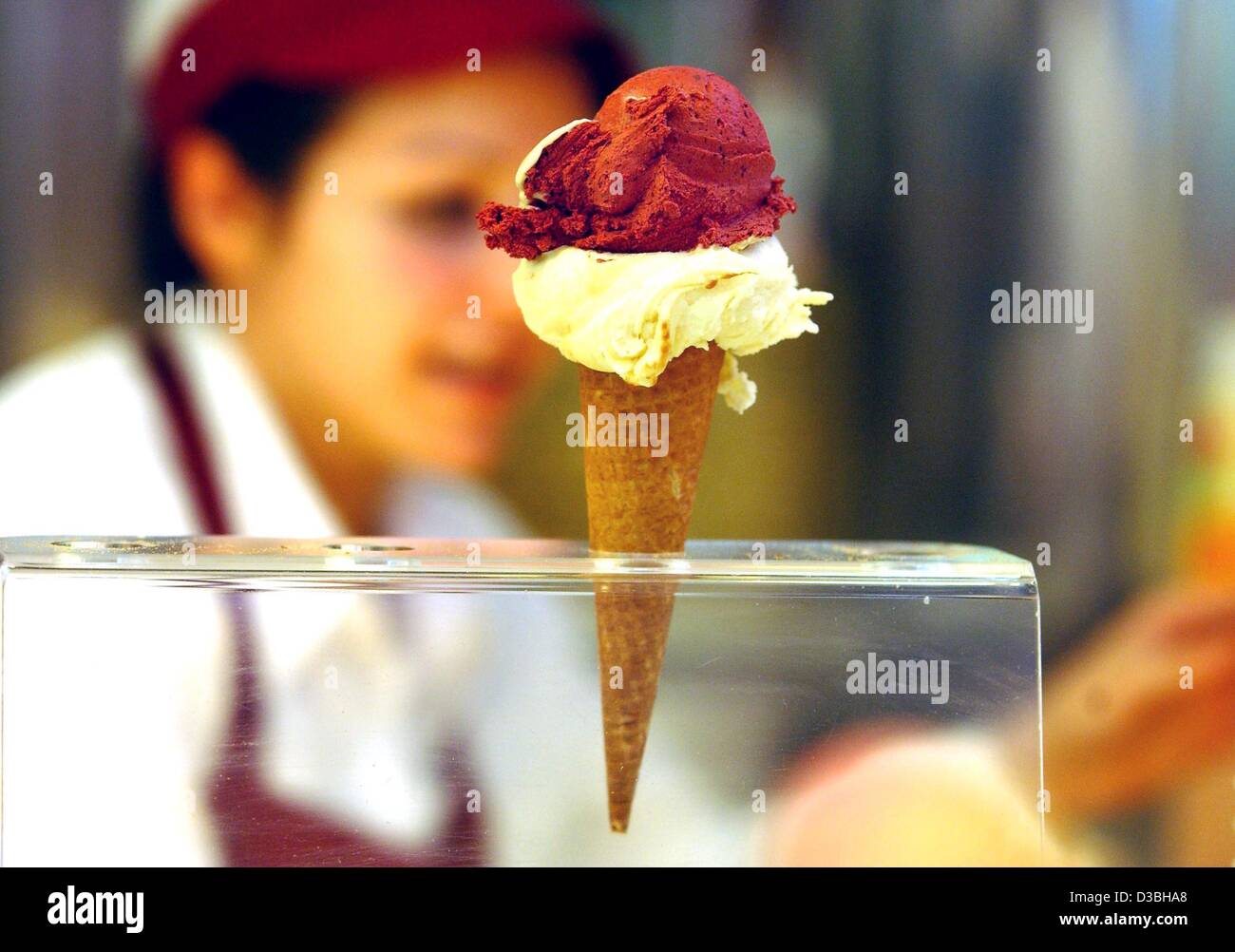 (dpa) - A cone with two scoops of ice cream is waiting to be grabbed, Berlin, 10 June 2003. Stock Photo