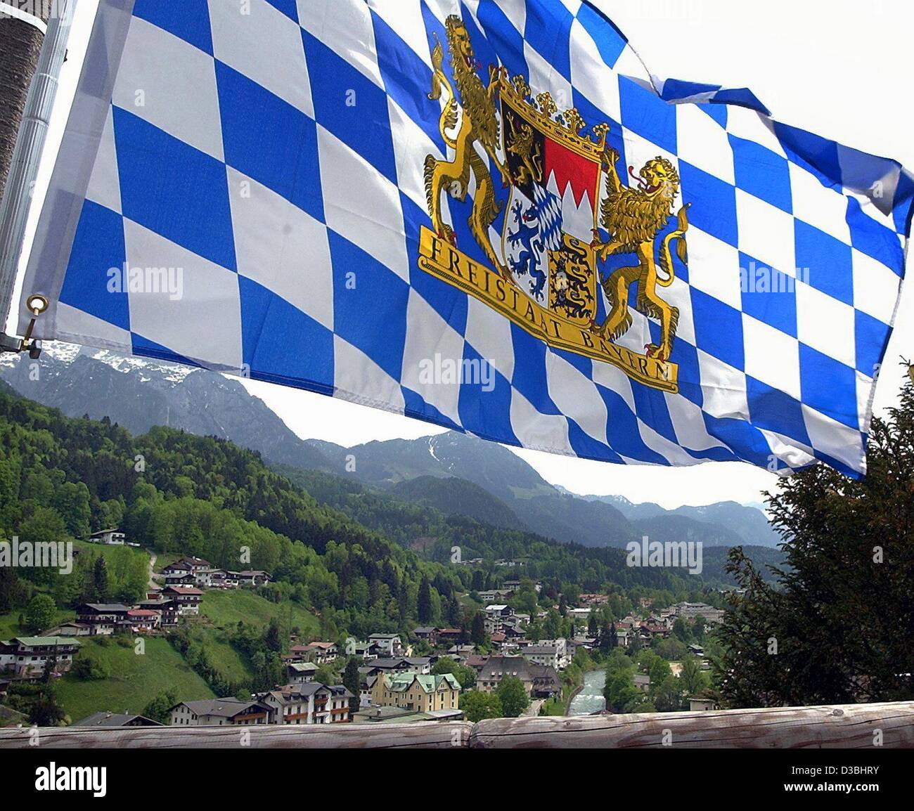 (dpa) - A Bavarian flag waves in the wind above a valley in Berchtesgarden, Germany, 9 May 2003. Stock Photo