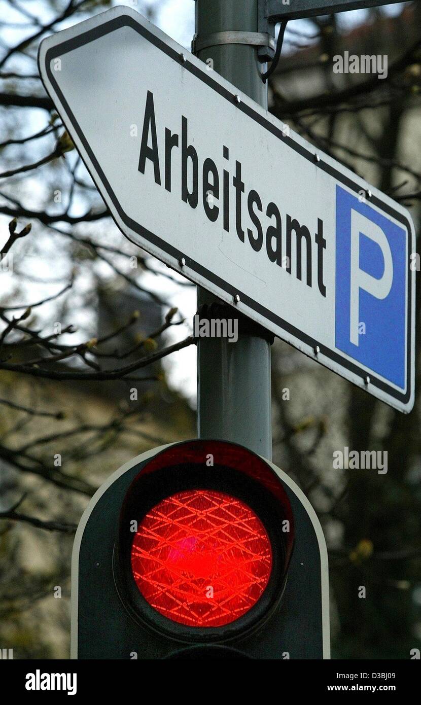 (dpa) - Above a traffic light, a sign which reads 'Arbeitsamt' (employment centre) directs cars to a car park near the job centre in Munich, Germany, 11 April 2003. Presently, about 4.6 million people are registered unemployed in Germany. Stock Photo