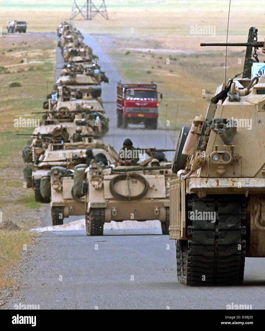 (dpa) - A convoy of US military tanks and armoured vehicles moves to Northern Iraq, near Al-Sharkat, 25 April 2003. Stock Photo