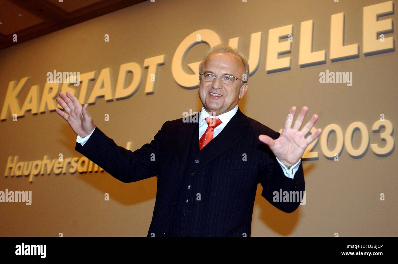 (dpa) - Wolfgang Urban, CEO of the retail and mail order group KarstadtQuelle AG, is posing in front of the corporate logo before the annual general meeting, Duesseldorf, Germany, 28 May 2003. After a difficult year 2002, KarstadtQuelle's present situation is reason for hope. Stock Photo