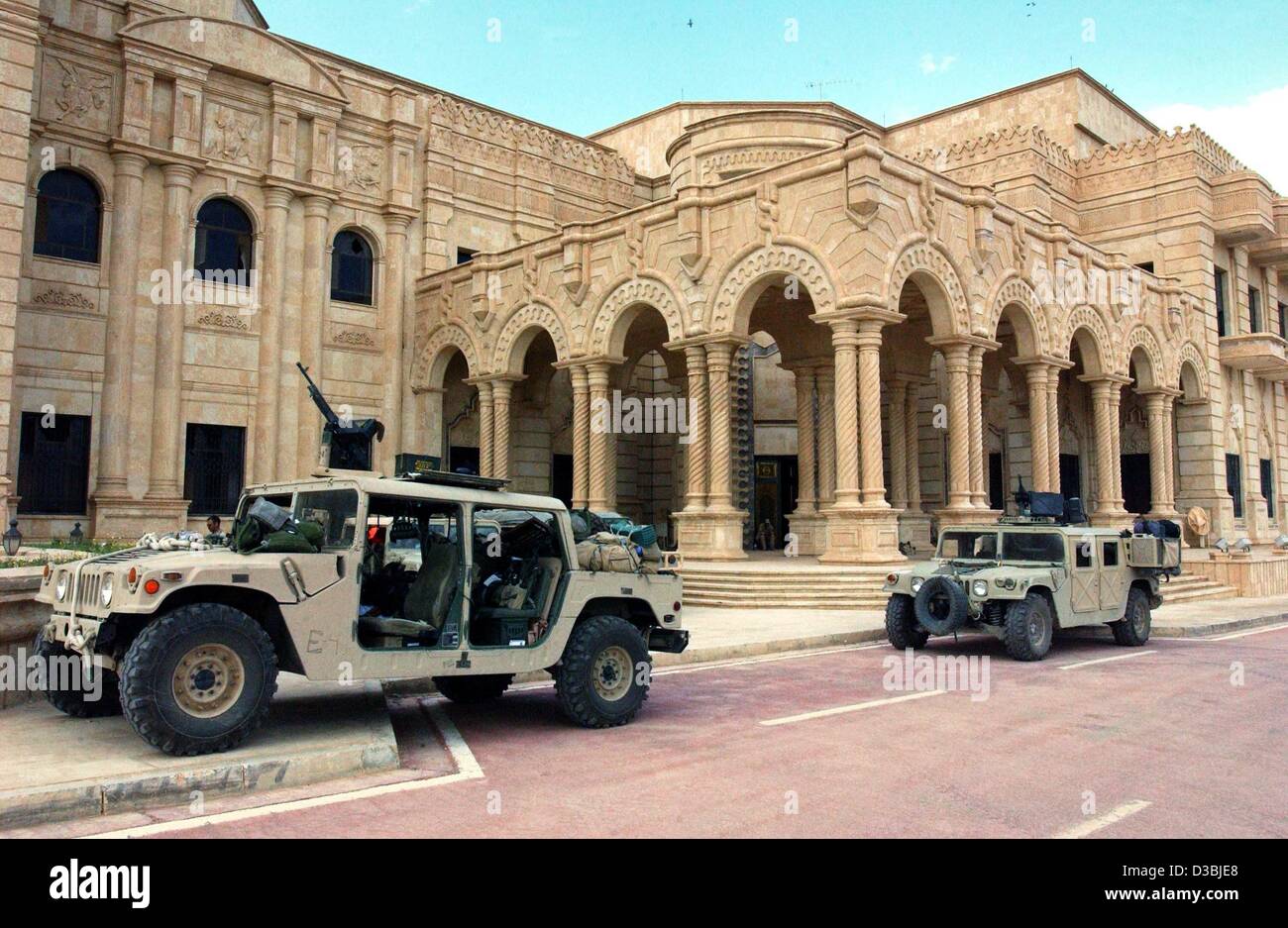 (dpa) - US Marines stand guard in front of Saddam Hussein's former summer residence in the northern Iraqi city of Tikrit, 14 April 2003. Tikrit, the hometown of Saddam, was the last stronghold of his regime whose fall would mark the effective end of the war. Stock Photo