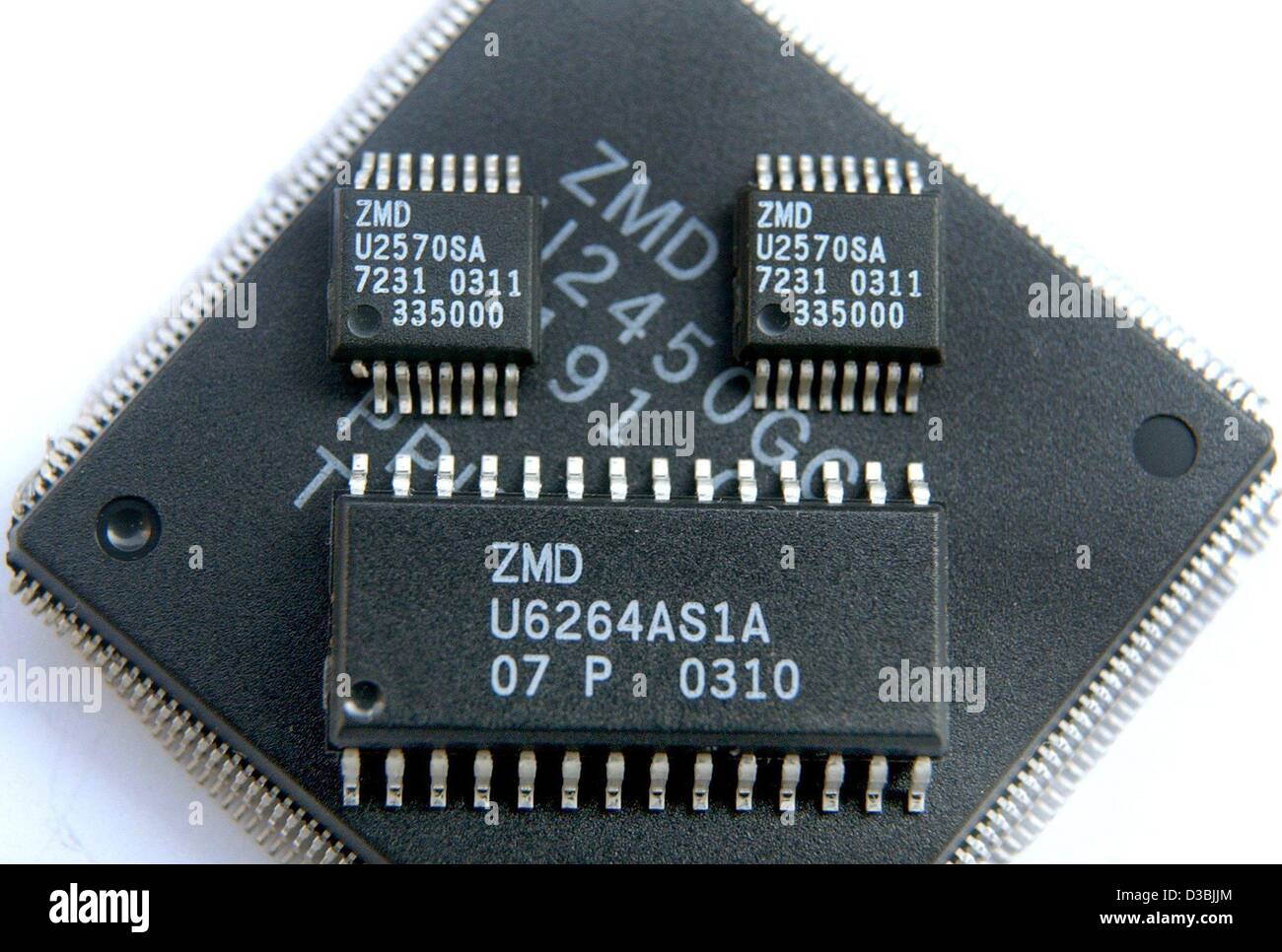 (dpa) - Standard circuits for computer chips of the chip manufacturer ZMD (Zentrum Mikroelektronik Dresden) are pictured in Dresden, Germany, 25 March 2003. ZMD mainly produces integrated circuits for automotive and industrial electronics, for medical technics and for infrared transmission as used i Stock Photo