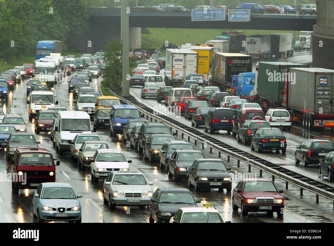(dpa) - Cars and trucks are stuck in a traffic jam on the A7 motorway in Hamburg, 23 May 2003. Especially on weekends this part of the motorway is often affected by traffic jams. Stock Photo