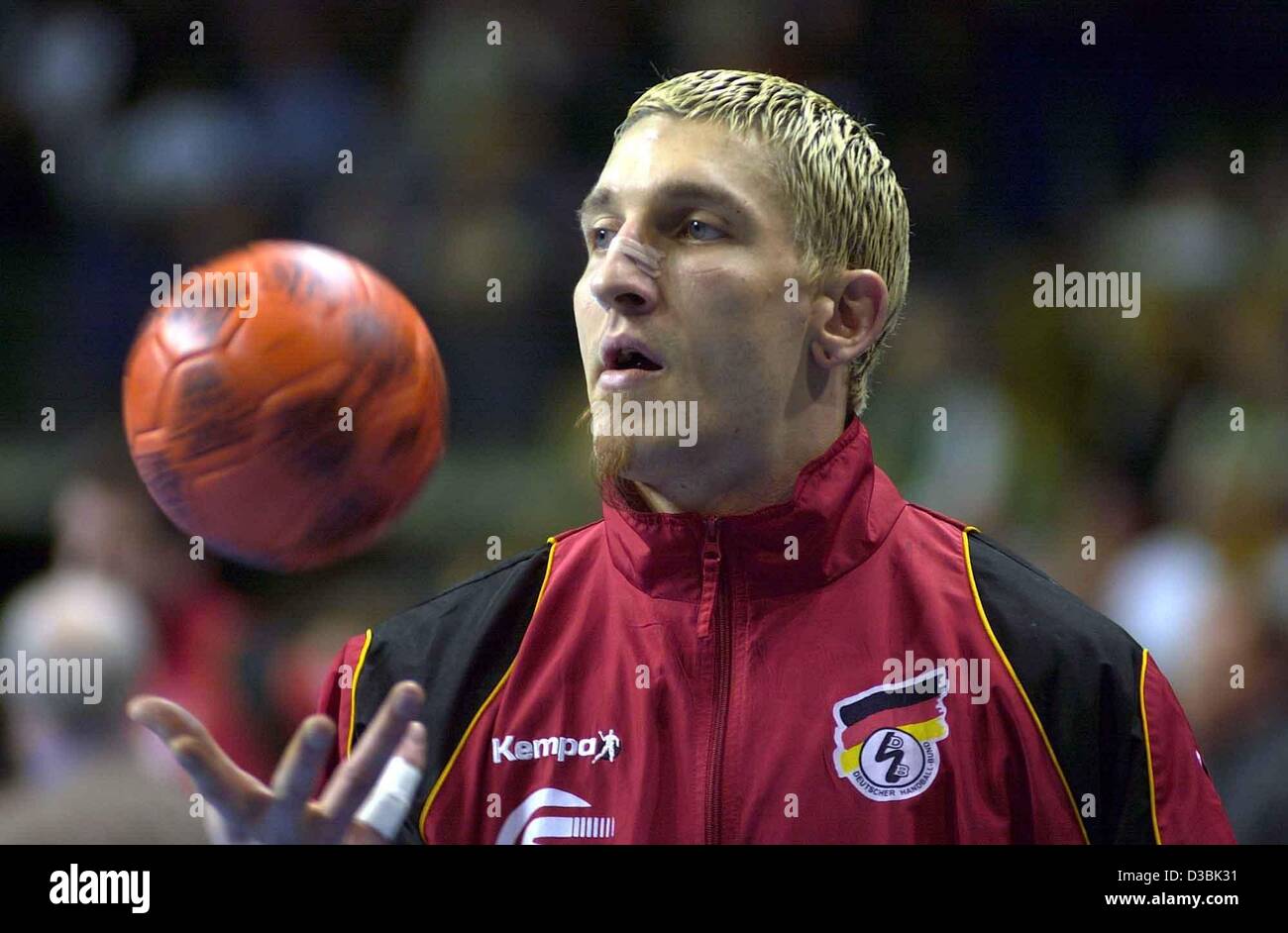 (dpa) - German handballer on the national team Stefan Kretzschmarspins a ball in his hand ready to play during the handball game Germany against Iceland in Berlin, Germany, 22 March 2003. Germany won 39-34. Kretzschmar managed to contribute five goals to the win. Stock Photo