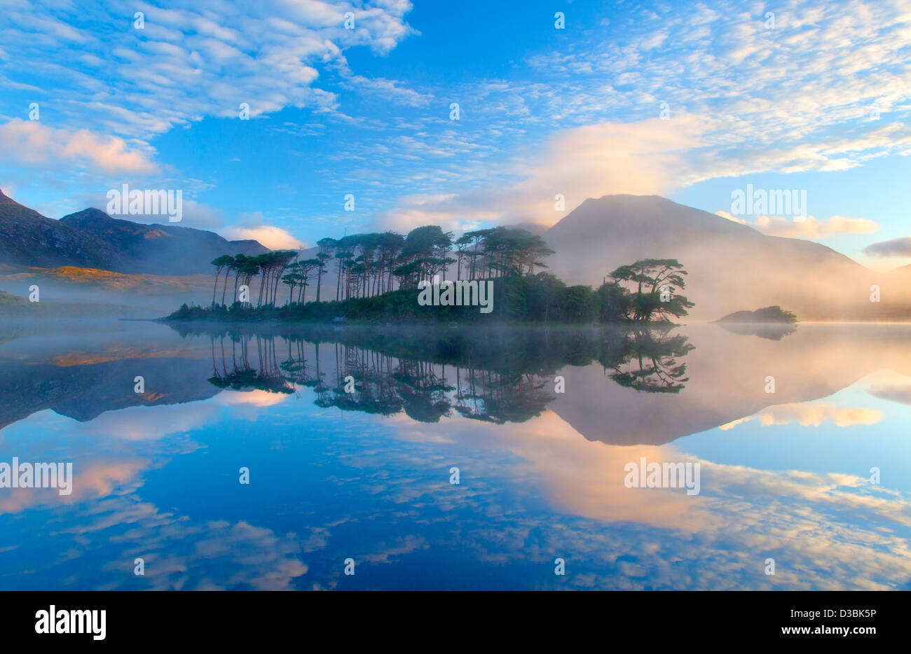 Misty morning reflection of the Twelve Bens in Derryclare Lough, Connemara, County Galway, Ireland. Stock Photo