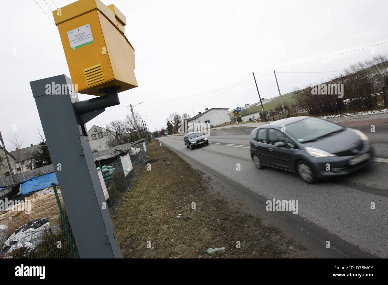 Baldram, Poland 15th, Fenruary 2013 Polish government has announced a new drive to cut the over 3,500 deaths a year on Polish roads , one of the worst road safety records in the EU , which includes placing more radar speed cameras at accident black spots. Pictured : new speed camera in village of Baldarm, Central Poland Stock Photo