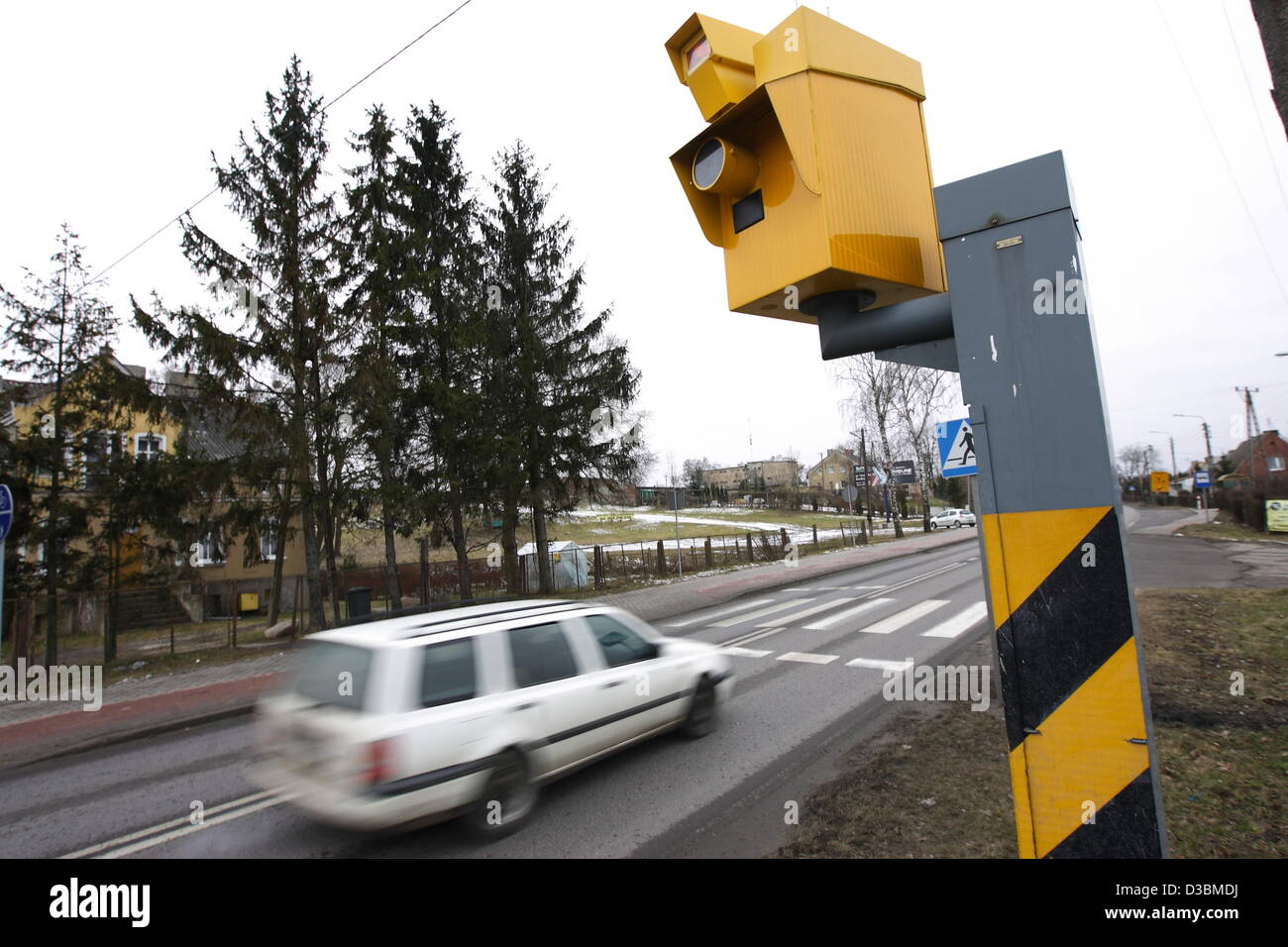 Baldram, Poland 15th, Fenruary 2013 Polish government has announced a new drive to cut the over 3,500 deaths a year on Polish roads , one of the worst road safety records in the EU , which includes placing more radar speed cameras at accident black spots. Pictured : new speed camera in village of Baldarm, Central Poland Stock Photo