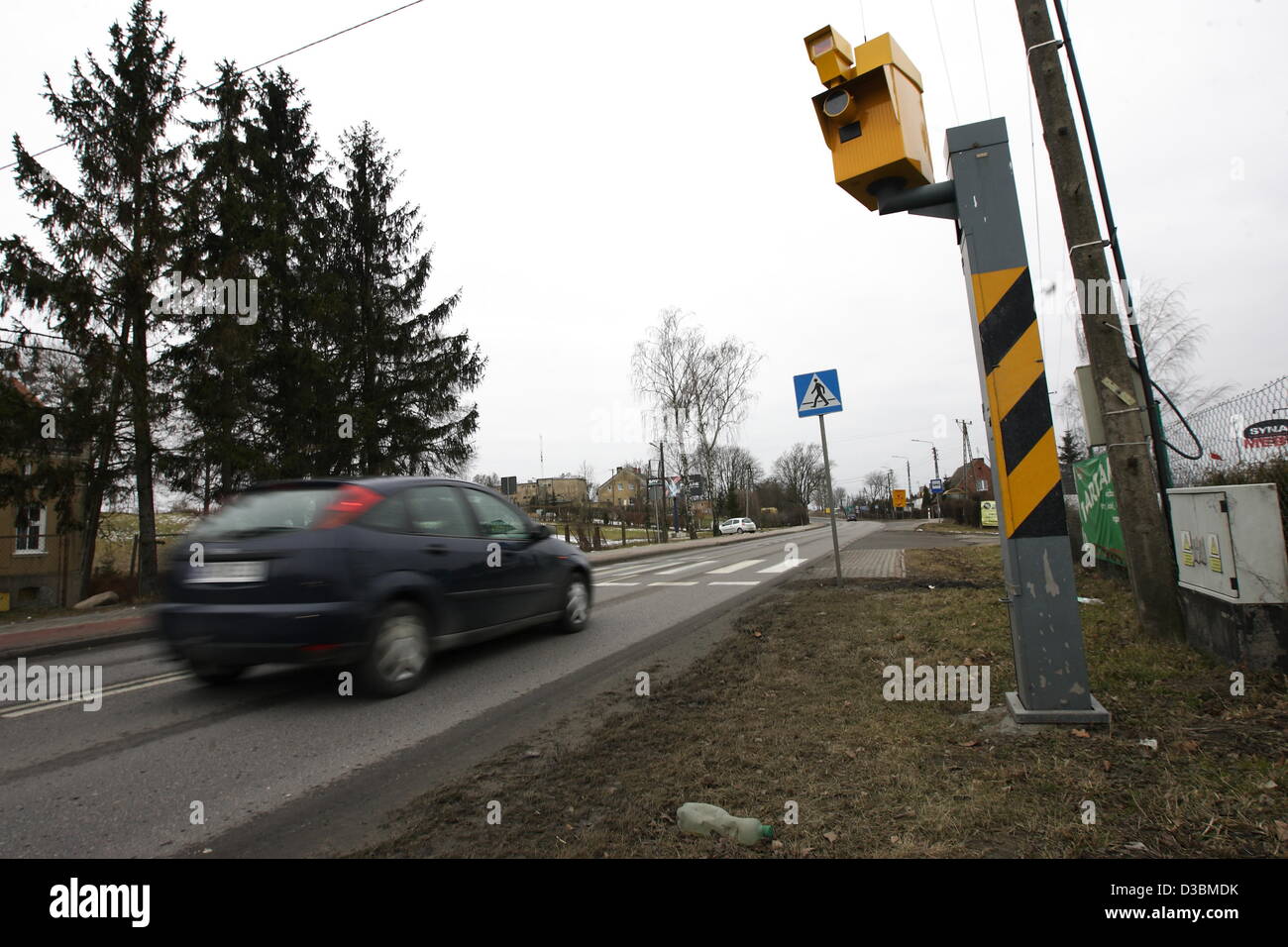 Baldram, Poland 15th, Fenruary 2013 Polish government has announced a new drive to cut the over 3,500 deaths a year on Polish roads , one of the worst road safety records in the EU , which includes placing more radar speed cameras at accident black spots. Pictured : new speed camera in village of Baldarm, Central Poland Stock Photo