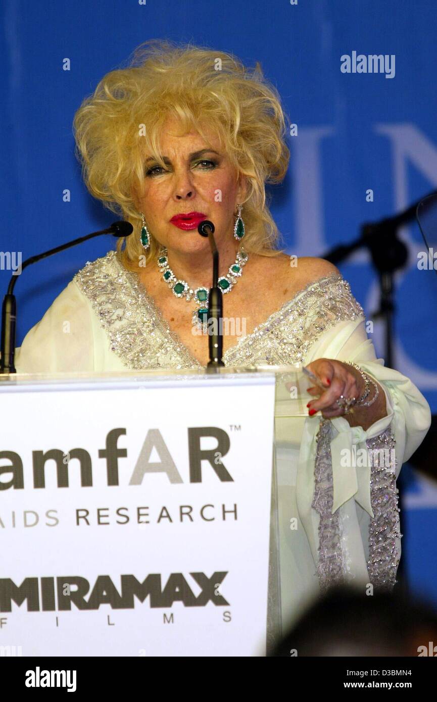(dpa) - Hollywood diva Elizabeth Taylor speaks during the auction at the AMFAR (American Foundation for Aids Research) charity gala at the Restaurant Moulin de Mougins near Cannes, France, 22 May 2003. The 71-year-old actress hosted the event which took in 1.3 million dollars in donations. Stock Photo