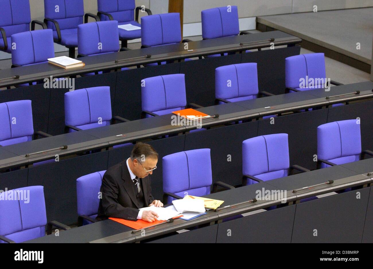(dpa) - Ahead of a meeting German Finance Minister Hans Eichel sits alone in the plenum of the German Bundestag (parliament) in Berlin, 4 April 2003. Stock Photo