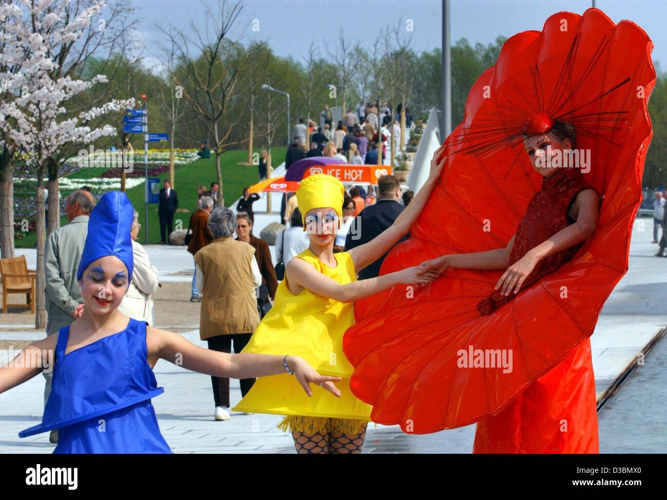 (dpa) - Young women dressed up as flowers and insects dance on the grounds of the International Horticultural Exhibition (IGA: Internationale Gartenbauausstellung), Rostock, Germany, 25 April 2003. The IGA opened on 25 April and will run through to 12 October 2003. 23 countries present their Gardens Stock Photo