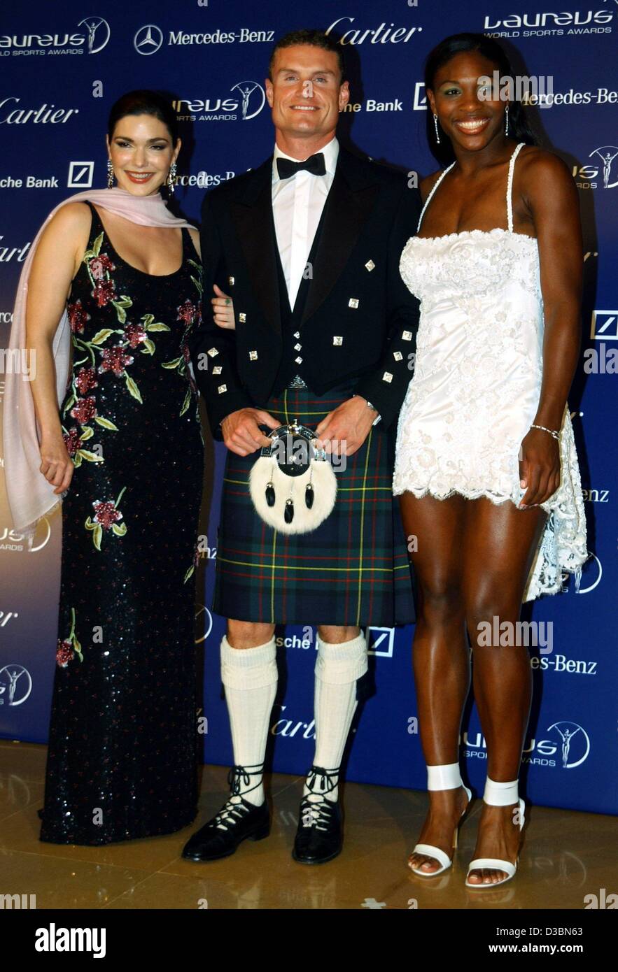 (dpa) - Scottish formula one pilot David Coulthard poses with US tennis player Serena Wiliams (R) and US actress Laura Harrig (L) at the Grimaldi Forum in Monte Carlo, 20 May 2003. Williams won an award in the category Sportswoman of the Year. Stock Photo
