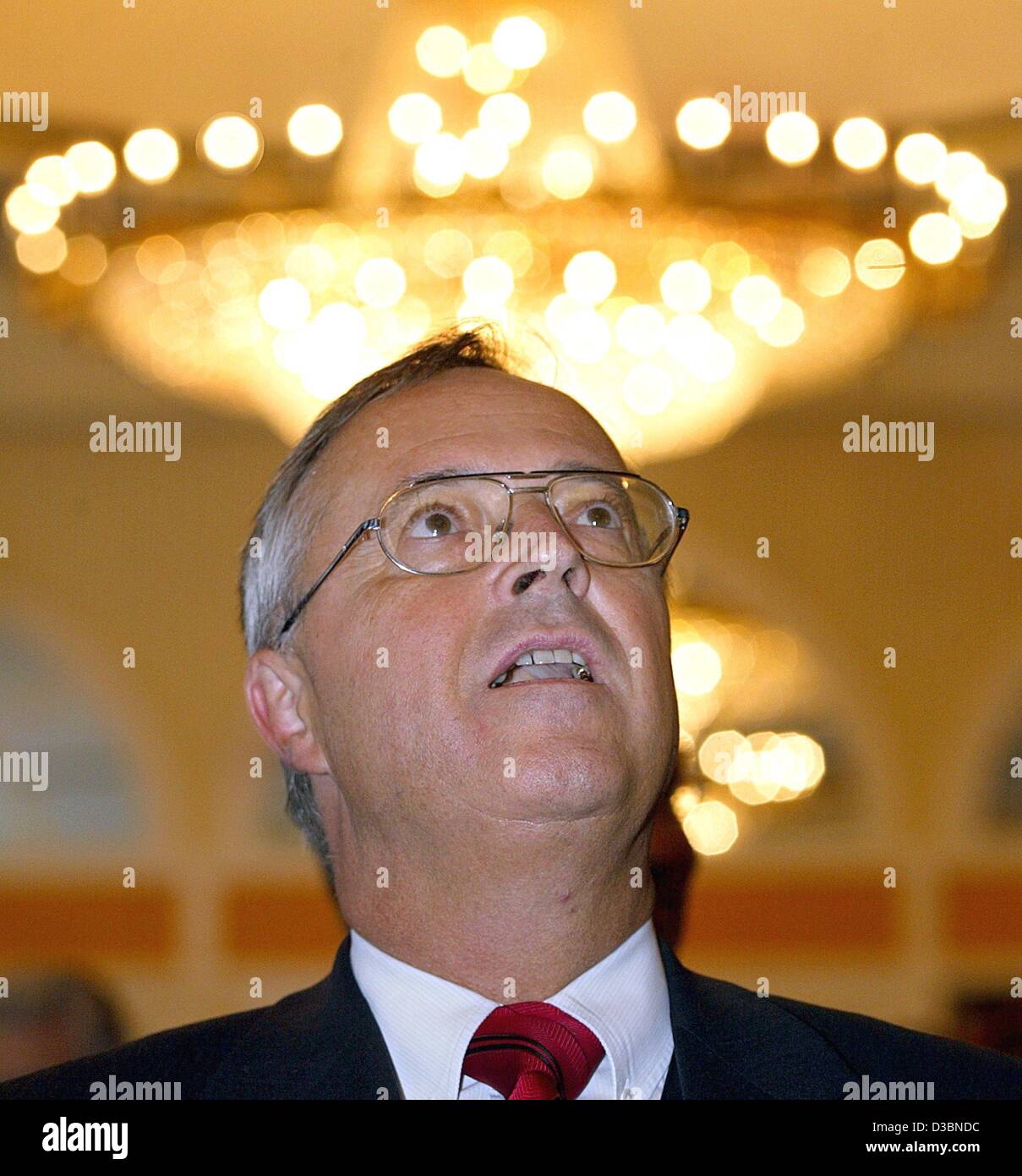 (dpa) - German Finance Minister Hans Eichel stand underneath a chandelier which gives the impression that he were wearing a gloriole, in Berlin, 21 May 2003. Slumping GDP projections last week led Eichel to admit Germany will suffer a massive tax revenue shortfall in the coming years and that Berlin Stock Photo