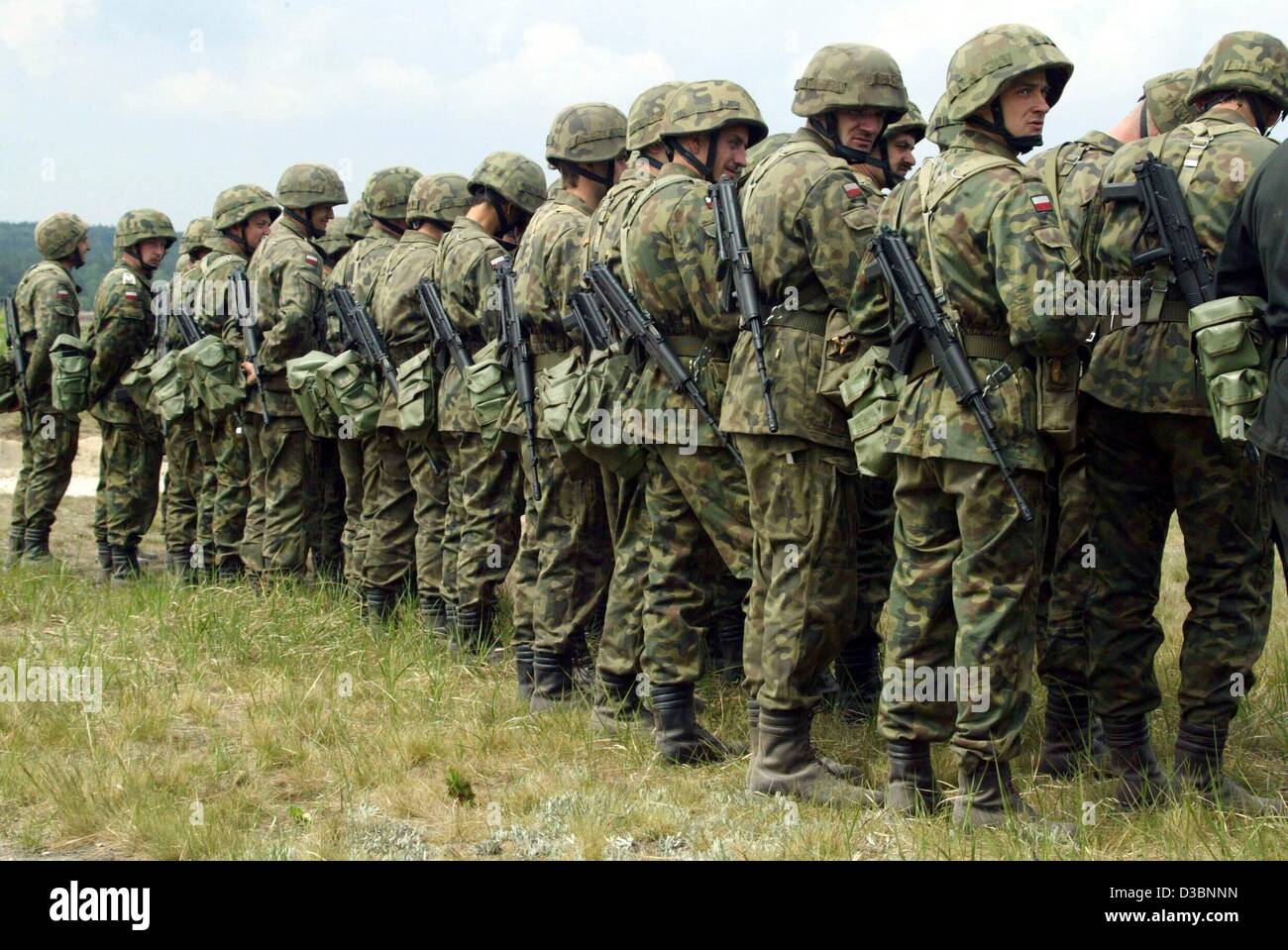 (dpa) - Polish soldiers line up during a military drill of the Polish army under the leadership of German officers near the German border in Swietoszow, Poland, 14 May 2003. Poland has officially asked a NATO military study on possible alliance support for Poland's planned military mission in Iraq.  Stock Photo