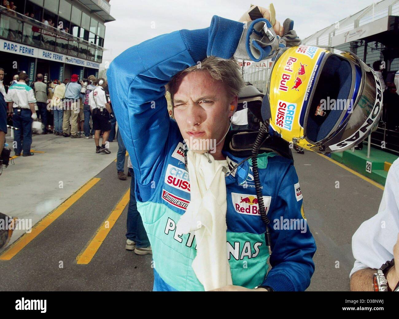 (dpa) - German formula one pilot Nick Heidfeld of the Sauber team takes off his helmet after the first qualifying training on the Albert Park race track in Melbourne, 7 March 2003. Heidfeld came in 12th. The Australian Grand Prix will kick off the formula one season on 9 March 2003 in Melbourne. Stock Photo