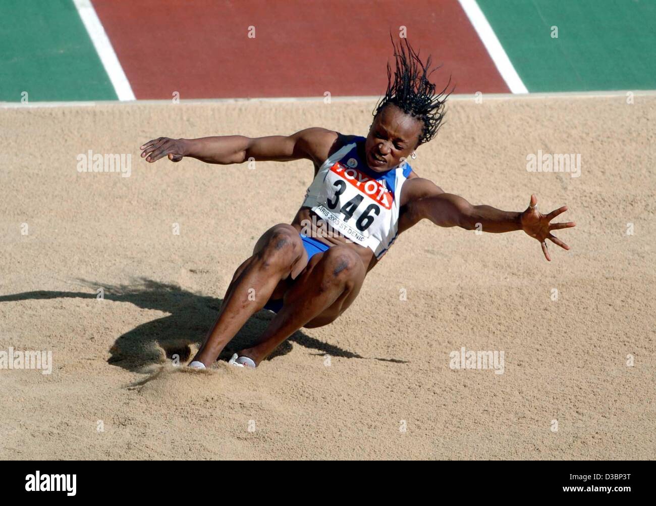 (dpa) - French athlete Eunice Barber lands in the sand during an attempt at the women's long jump competition in the heptathlon event at the 9th IAAF Athletic World Championships at the Stade de France in Paris, 24 August 2003. Barber won the silver medal. Stock Photo