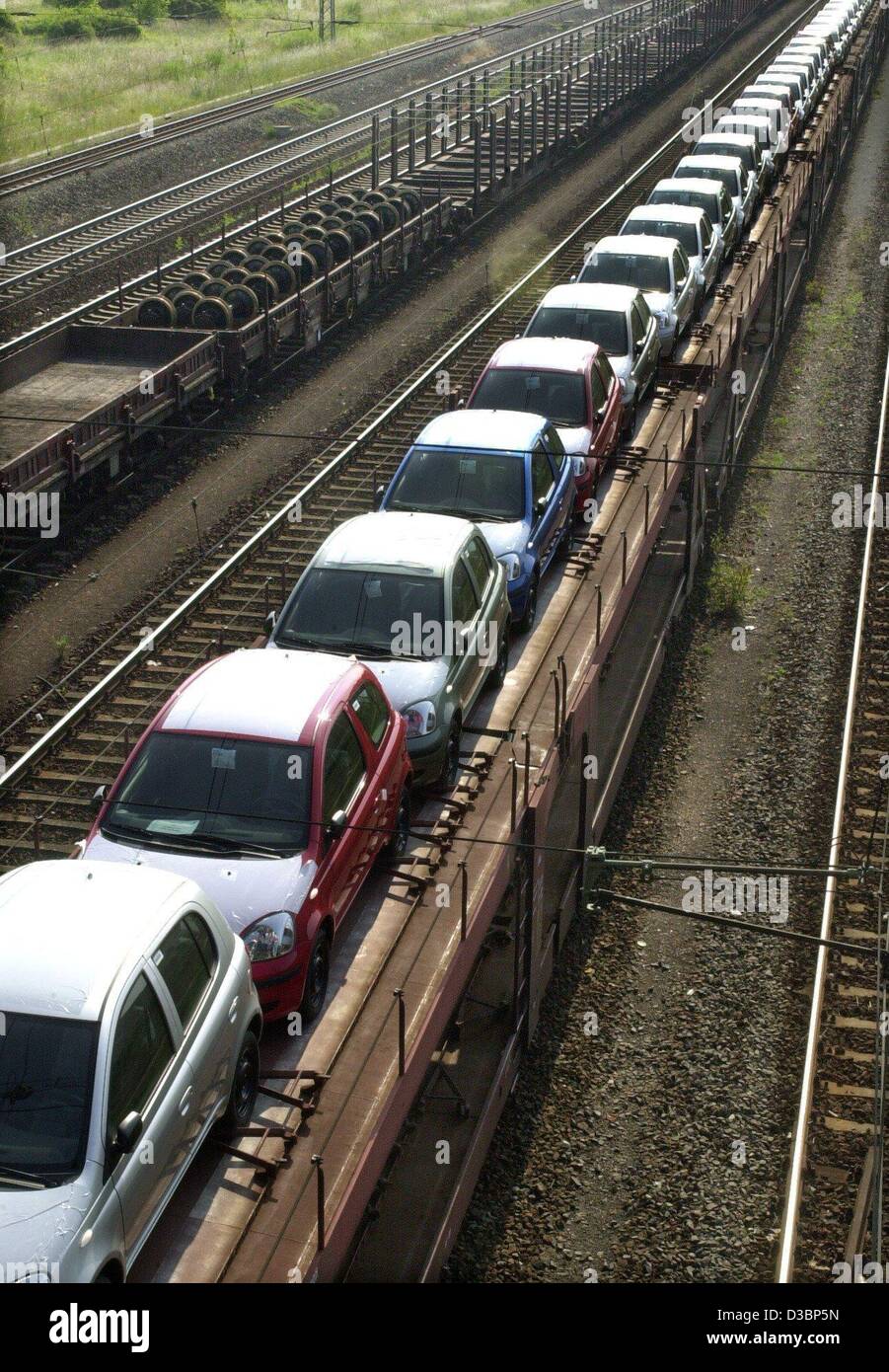 (dpa) - Rows of cars are loaded on special railway carriages in Magdeburg, Germany, 25 June 2003. Around five million cars are annually produced in Germany. Around 70 percent of the cars are intended for export abroad. Foreign makes of cars were abel to increase their sales in Germany by two percent Stock Photo