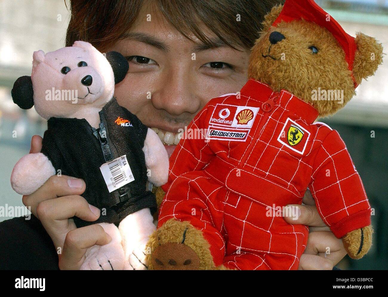 dpa A souvenir merchant shows teddy bears with a Ferrari R