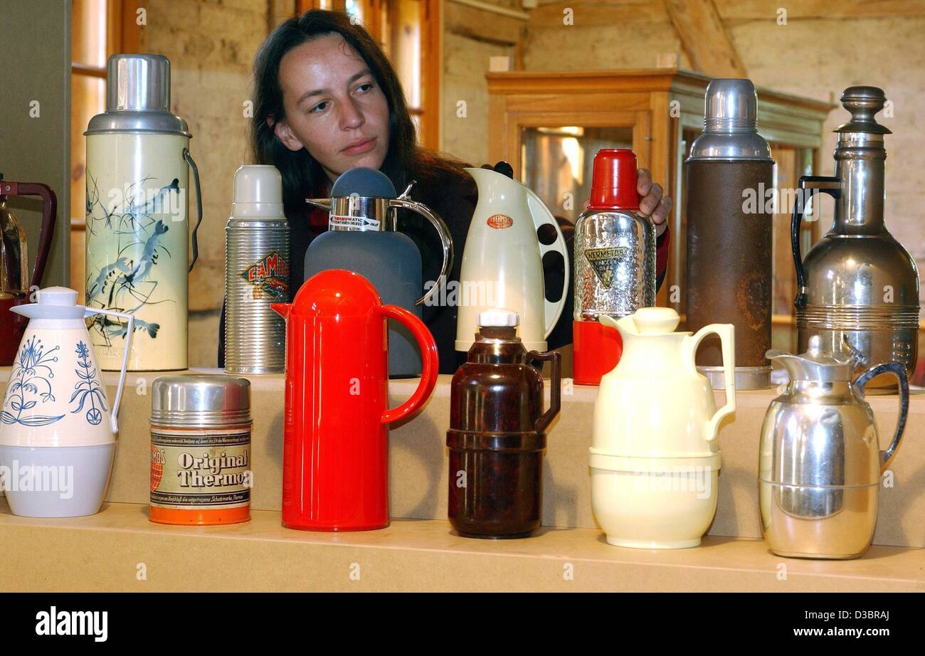 dpa) - A visitor looks at a variety of thermos flasks at the museum in  Glashuette, Germany, 26 September 2003. The inventor of the useful flasks,  Reinhold Burger (1866-1954) hails from the