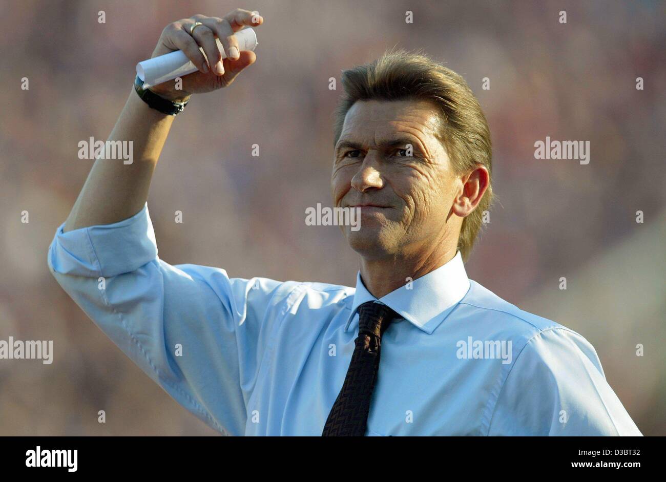 (dpa) - Klaus Augenthaler, the coach of the soccer club Bayer 04 Leverkusen, smiles during the sixth round Bundesliga game against FC Bayern Munich, in Munich, 20 September 2003. The game ended in a 3-3 draw. Leverkusen currently ranks second, Bayern Munich fifth in the German first division. Stock Photo