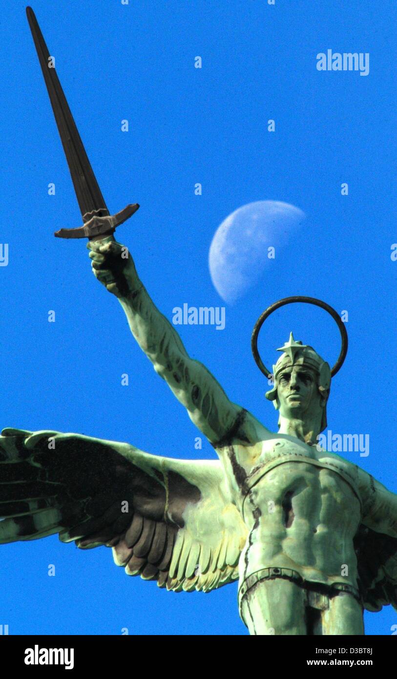 (dpa) - The statue of archangel Michael stretches into the sky with a ...