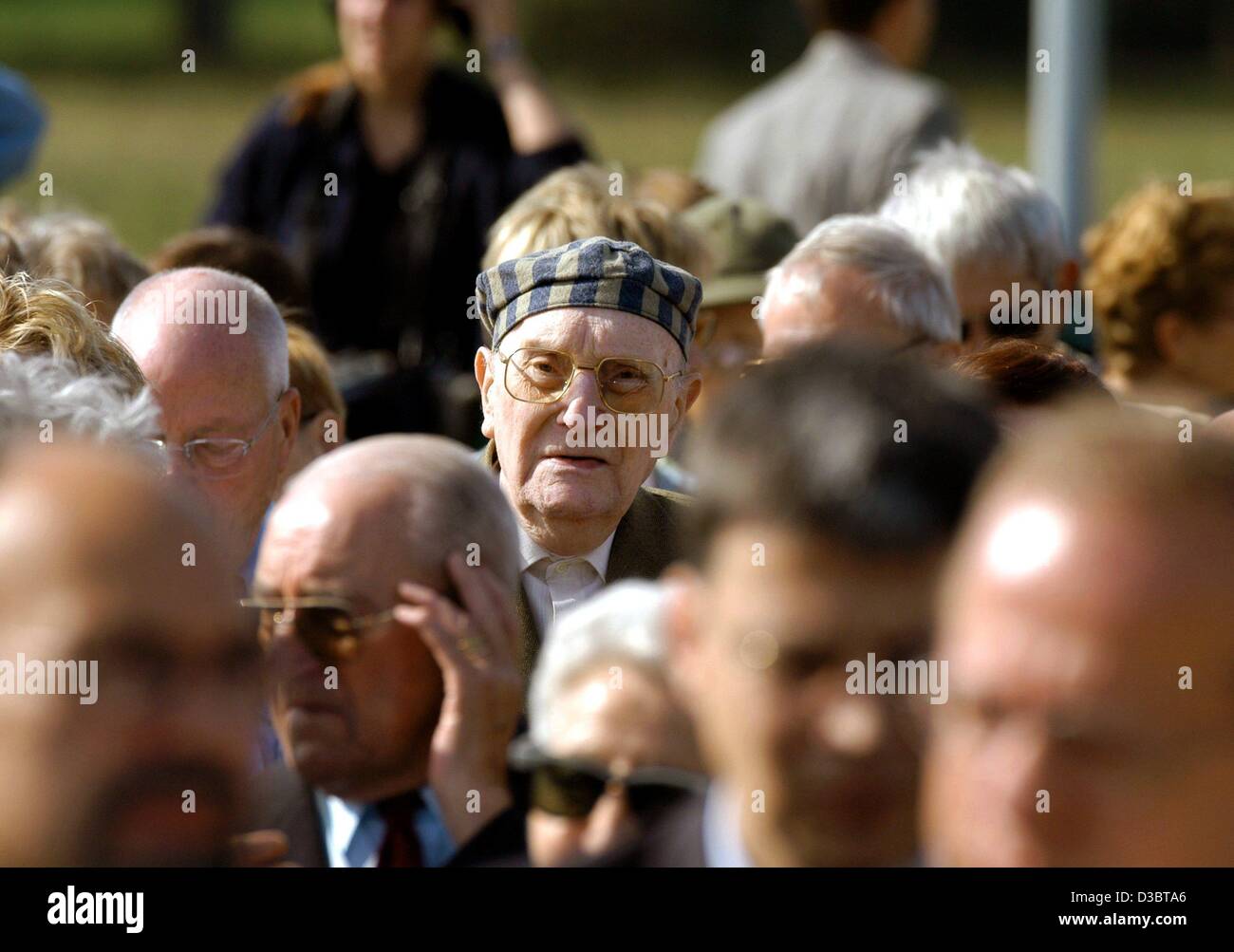 (dpa) - Former prisoners listen to a speech during a commemoration ceremony at the former Nazi concentration camp Neuengamme in Hamburg, 6 September 2003. About 300 former prisoners and surviving members of their families came to commemorate the victims of the holocaust. The SS established the Neuen Stock Photo