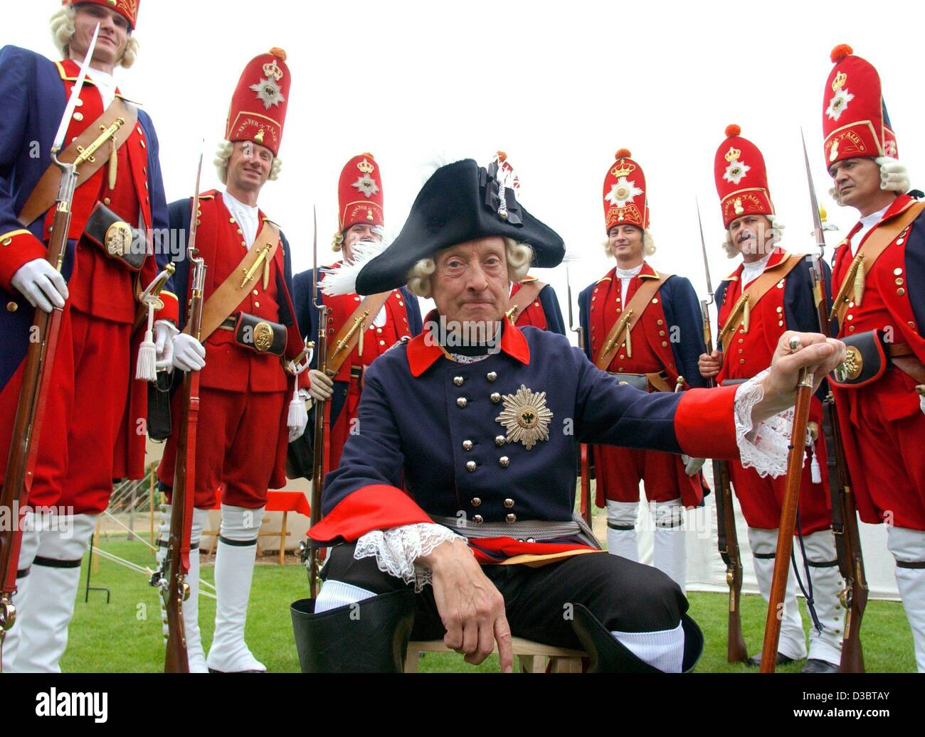 (dpa) - Rolf Zahren poses as Friedrich II (Frederick II) with his guard, the 'Lange Kerls' (big blokes), in historic uniforms in Bornstedt, Germany, 12 September 2003. The club has performances all over Europe. Stock Photo